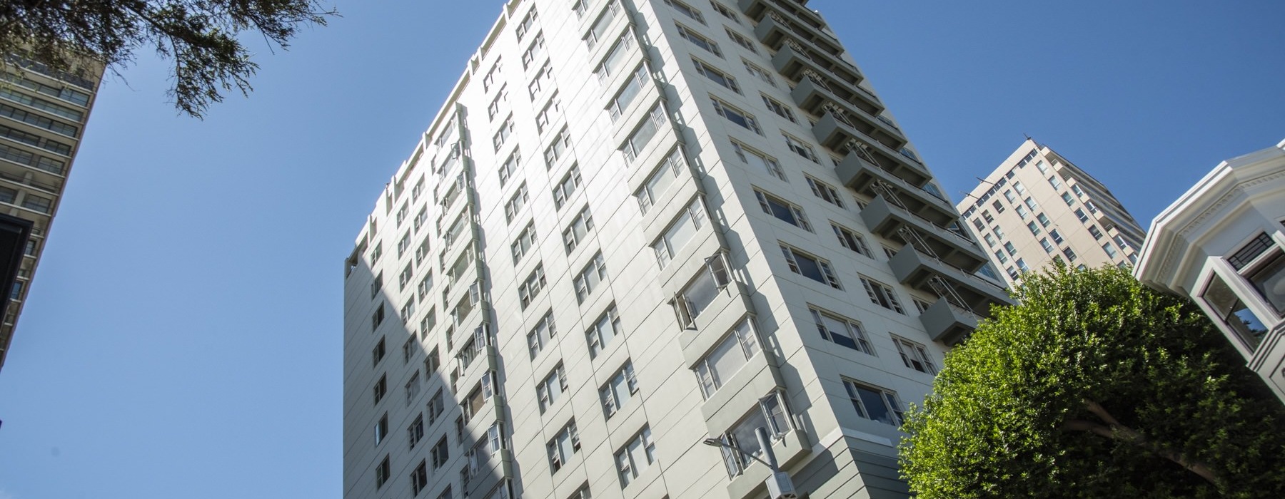 a tall building with a street sign
