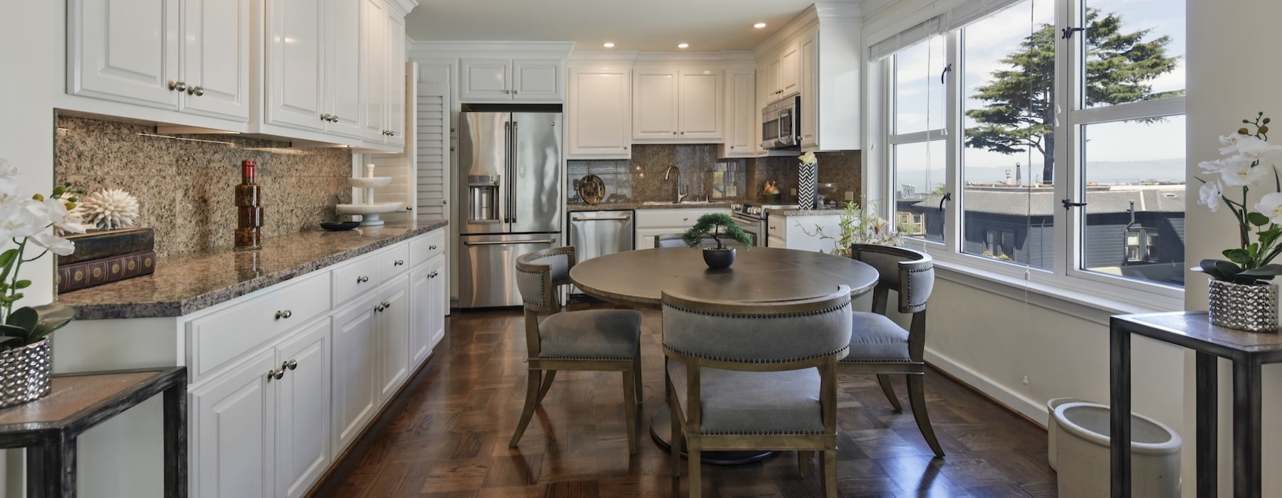 a kitchen with a dining table and chairs