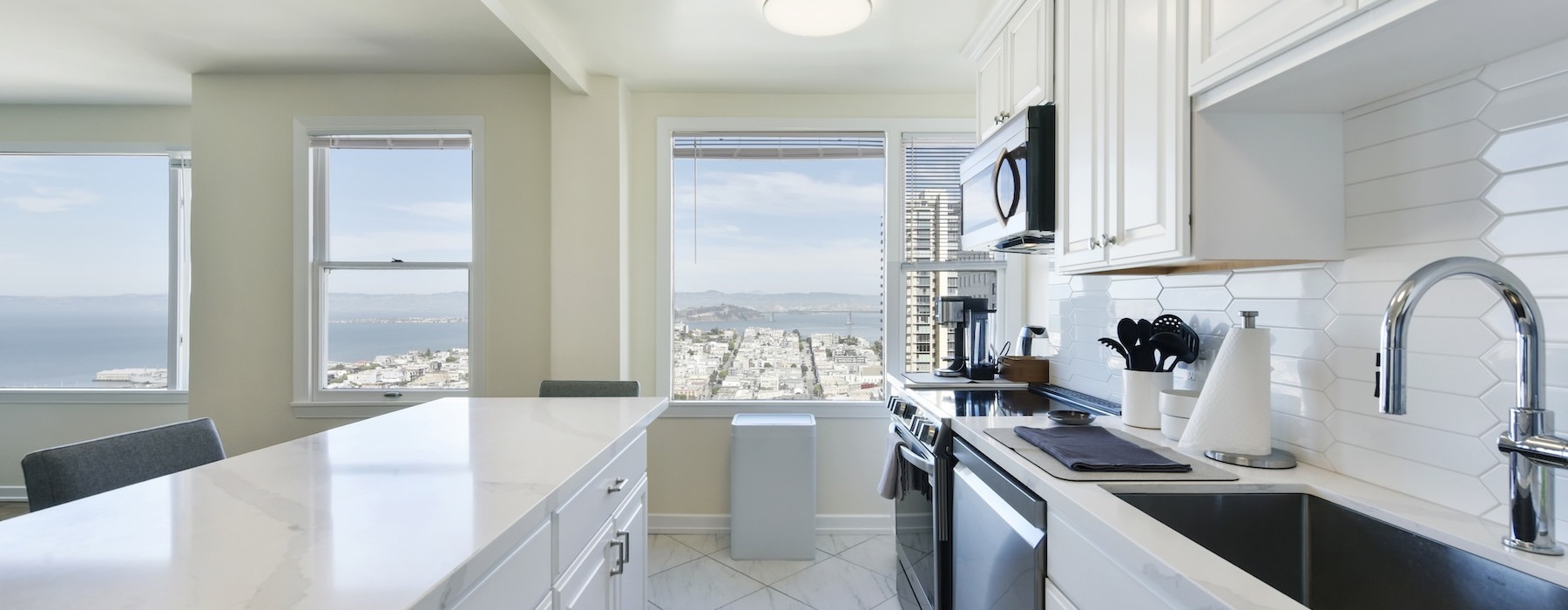 a kitchen with white cabinets