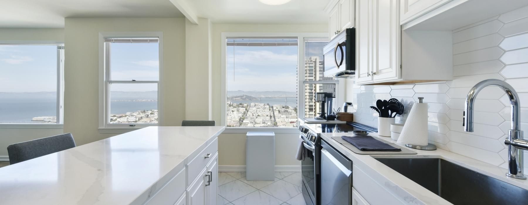 a kitchen with white cabinets